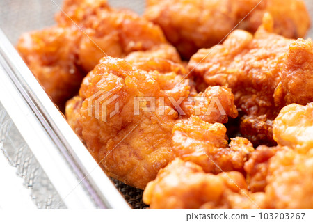 Takeout image. Deep-fried chicken in a clear plastic container. Takeout image. Deep-fried chicken in a clear plastic container. 103203267
