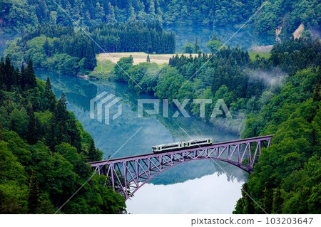 Tadami Line Kiha 110 series train crossing the first Tadami River bridge in spring (Mishima Town, Fukushima Prefecture, early morning in mid-May) Tadami Line Kiha 110 series train crossing the first Tadami River bridge in spring (Mishima Town, Fukushima Prefecture, early morning in mid-May) 103203647