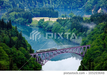 Tadami Line Kiha 110 series train crossing the first Tadami River bridge in spring (Mishima Town, Fukushima Prefecture, early morning in mid-May) Tadami Line Kiha 110 series train crossing the first Tadami River bridge in spring (Mishima Town, Fukushima Prefecture, early morning in mid-May) 103203648