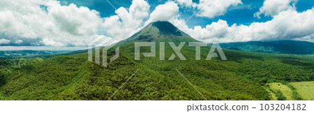 Amazing view of beautiful Arenal volcano in Costa Rica. Panorama of volcano Arenal reflected on wonderful picturesque lake, La Fortuna, Costa Rica. Central America. 103204182