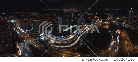 Aerial view of the Istambul business district. Rapidly developing business and finance area of Istanbul with highrises and shopping malls. Commercial buildings at night 103204186