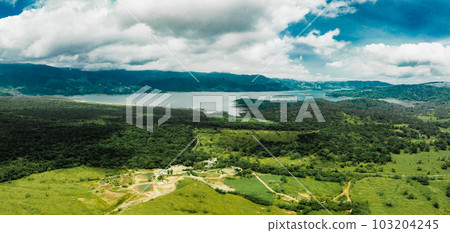Amazing view of beautiful nature in Costa Rica. Green trees growing in rainy forest on gloomy day in costa rica Amazing view of beautiful nature in Costa Rica. Green trees growing in rainy forest on gloomy day in costa rica 103204245