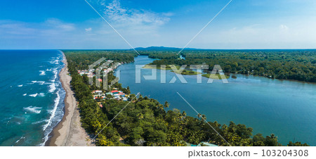 Village of Tortuguero. Caribbean sea on the one side, village inside the jungle in the middle, and huge river on the otjer side. Amazing place full of wildlife in Costa Rica 103204308