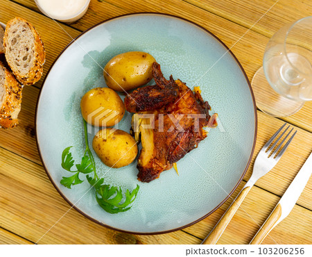 Tasty dish of chicken thighs and boiled potatoes Tasty dish of chicken thighs and boiled potatoes 103206256
