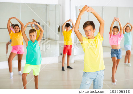Group of kids training dance moves Group of kids training dance moves 103206518