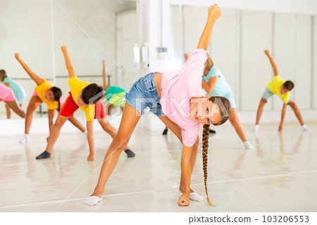 Children exercising dance moves together Children exercising dance moves together 103206553