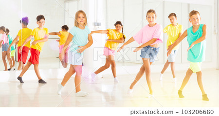 Children studying modern style dances in class indoors Children studying modern style dances in class indoors 103206680
