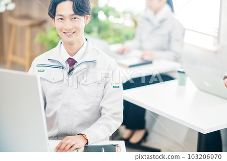 Young engineer at desk work 103206970