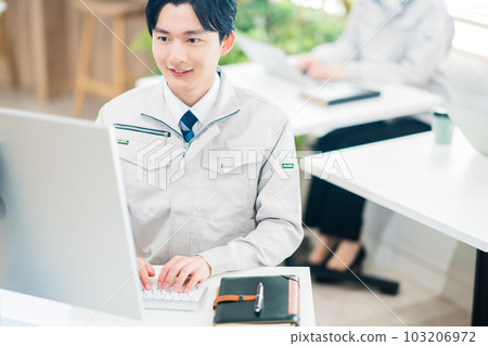 Young engineer at desk work 103206972