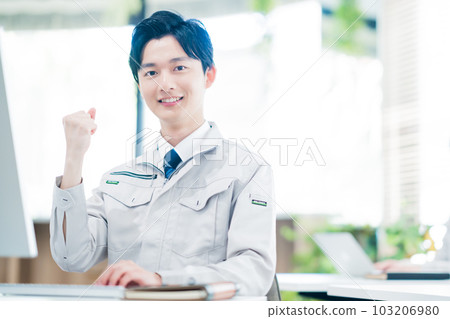 Engineer with fist pump working in the office 103206980