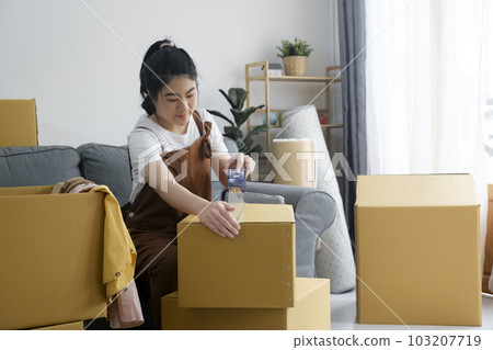 Modern female people in moving home apartment leisure indoor activity alone. Modern female people in moving home apartment leisure indoor activity alone. 103207719