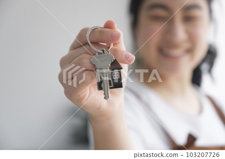 Woman owner buy purchase home, relocate to dwelling, rental, rent, ownership concept Woman owner buy purchase home, relocate to dwelling, rental, rent, ownership concept 103207726
