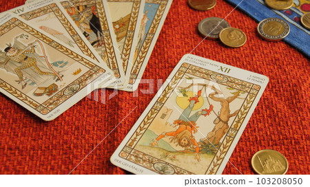 The Hanged Man's card on the red cross The Hanged Man's card on the red cross 103208050