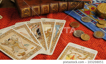 Various tarot cards on red cross 103208051