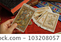 Hand with strange (power) card 103208057