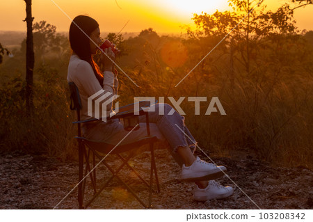 woman traveler with view landscape holding coffee cup. woman traveler with view landscape holding coffee cup. 103208342