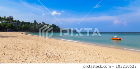 Beautiful Surin beach in Choeng Thale city, Phuket, Thailand with white sand, turquoise water, boat and palm trees Beautiful Surin beach in Choeng Thale city, Phuket, Thailand with white sand, turquoise water, boat and palm trees 103210522
