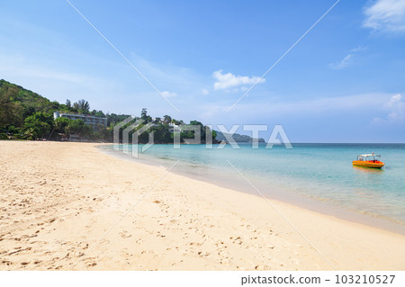Beautiful Surin beach in Choeng Thale city, Phuket, Thailand with white sand, turquoise water and palm trees Beautiful Surin beach in Choeng Thale city, Phuket, Thailand with white sand, turquoise water and palm trees 103210527