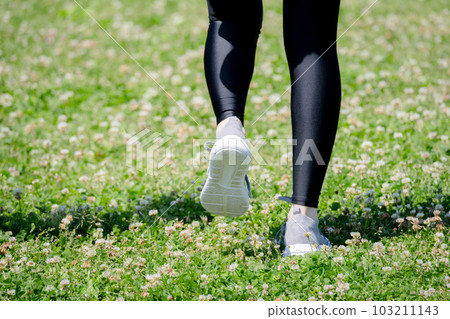 Feet of a young woman exercising in the park Feet of a young woman exercising in the park 103211143