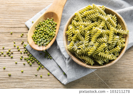 Mung bean fusilli pasta on a old wooden background. 103211278