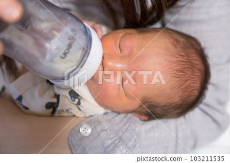 Baby drinking milk Baby drinking milk 103211535