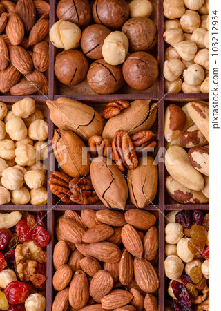Mix of roasted macadamia nuts, cashews, pecans, almonds, raisins and dry berries Mix of roasted macadamia nuts, cashews, pecans, almonds, raisins and dry berries 103212934