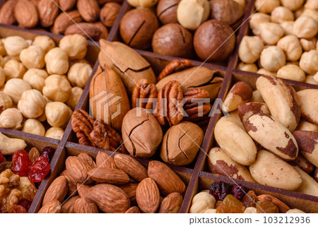 Mix of roasted macadamia nuts, cashews, pecans, almonds, raisins and dry berries 103212936