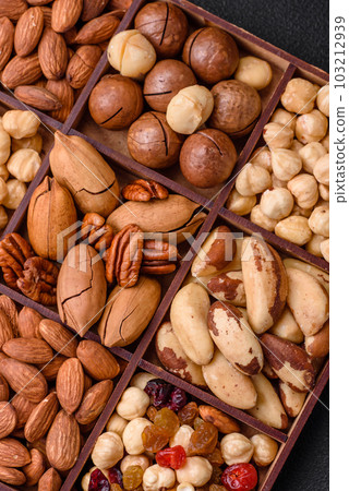 Mix of roasted macadamia nuts, cashews, pecans, almonds, raisins and dry berries Mix of roasted macadamia nuts, cashews, pecans, almonds, raisins and dry berries 103212939