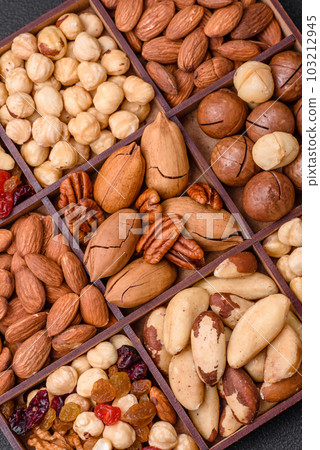 Mix of roasted macadamia nuts, cashews, pecans, almonds, raisins and dry berries Mix of roasted macadamia nuts, cashews, pecans, almonds, raisins and dry berries 103212945