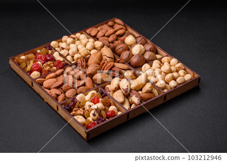 Mix of roasted macadamia nuts, cashews, pecans, almonds, raisins and dry berries Mix of roasted macadamia nuts, cashews, pecans, almonds, raisins and dry berries 103212946