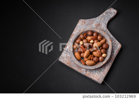 Mix of roasted macadamia nuts, cashews, pecans, almonds, raisins and dry berries Mix of roasted macadamia nuts, cashews, pecans, almonds, raisins and dry berries 103212969