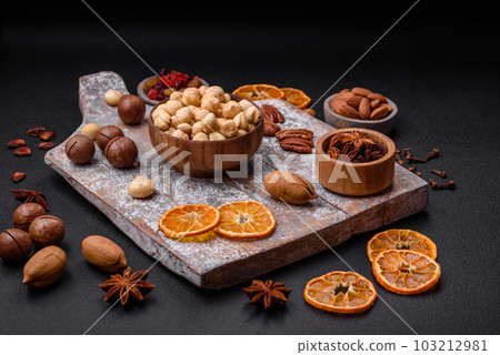 Mix of roasted macadamia nuts, cashews, pecans, almonds, raisins and dry berries 103212981