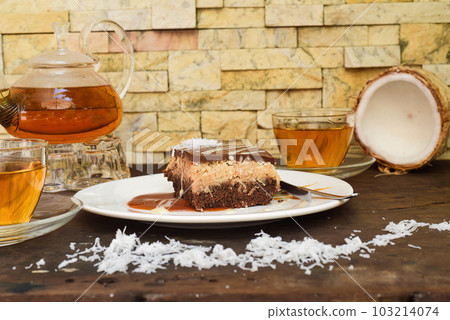 Bounty Cake made of fresh coconut on a table Bounty Cake made of fresh coconut on a table 103214074