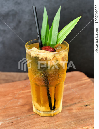 Iced chamomile tea with goji berry on wooden table Iced chamomile tea with goji berry on wooden table 103214091