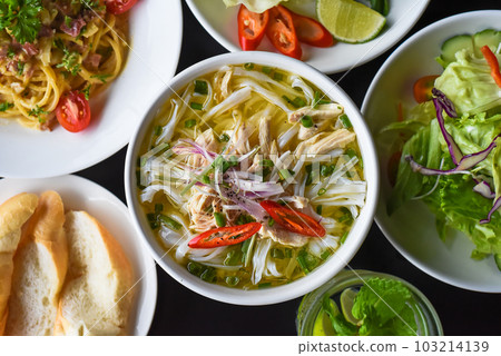 Lunch set made of chicken soup, salad,pasta carbonara, lemonade on black background 103214139