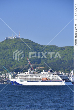 Photographing the scenery of the cruise ship Hanseatic Nature that calls at Hakodate Port in Hakodate City, Hokkaido in early summer 103217253