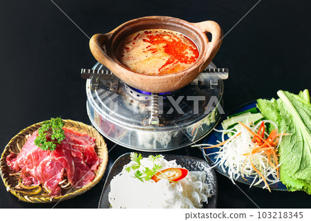 Korean spicy hot pot with beef meat and noodles on brick background 103218345