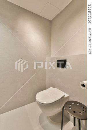 a bathroom with a toilet in the middle and a sink on the other side next to the toilet is white a bathroom with a toilet in the middle and a sink on the other side next to the toilet is white 103218408