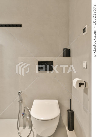 a bathroom with a toilet and shower head mounted on the wall next to it is an image of a man's face a bathroom with a toilet and shower head mounted on the wall next to it is an image of a man's face 103218578