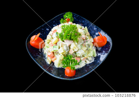 Russian salad olivie on black background top view Russian salad olivie on black background top view 103218876