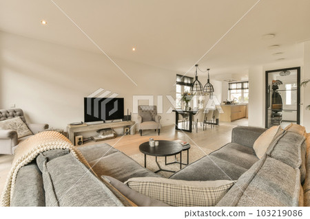 a living room with two couches and a coffee table in the center of the room is an open floor plan 103219086