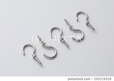 A screw with a hook photographed against a white background A screw with a hook photographed against a white background 103219328