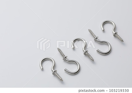 A screw with a hook photographed against a white background A screw with a hook photographed against a white background 103219330