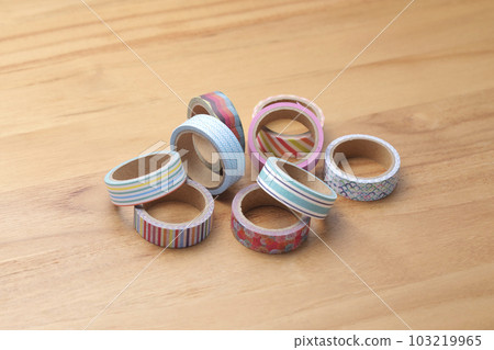 Masking tape taken on a wooden table Masking tape taken on a wooden table 103219965