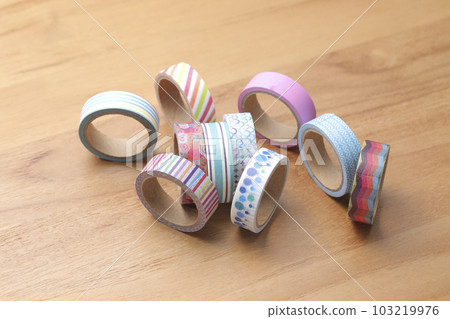 Masking tape taken on a wooden table Masking tape taken on a wooden table 103219976