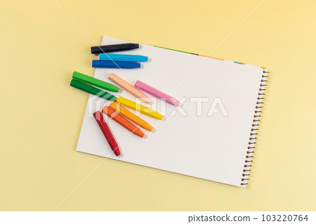 school supplies and diary concept, sketchbook and crayons school supplies and diary concept, sketchbook and crayons 103220764