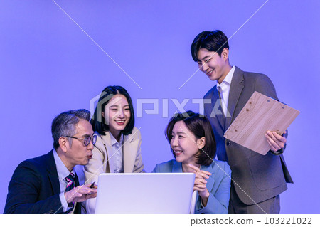 Asian Korean senior, middle aged and young male and female colleagues models in business attire, neon purple studio background, meeting while looking at a laptop Asian Korean senior, middle aged and young male and female colleagues models in business attire, neon purple studio background, meeting while looking at a laptop 103221022