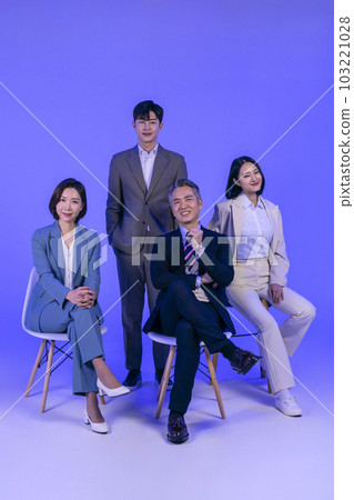 Asian Korean senior, middle aged and young male and female colleagues models in business attire, neon purple studio background, smiling 103221028