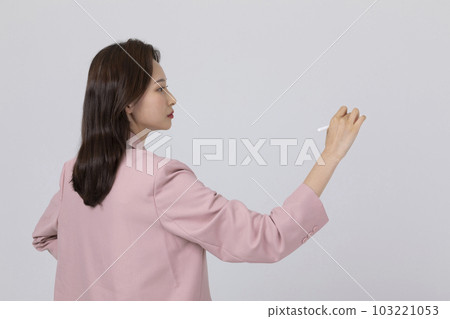 business concept korean young woman, standing with holding a pen 103221053