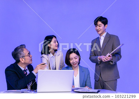 Asian Korean senior, middle aged and young male and female colleagues models in business attire, neon purple studio background, explain documents Asian Korean senior, middle aged and young male and female colleagues models in business attire, neon purple studio background, explain documents 103221299
